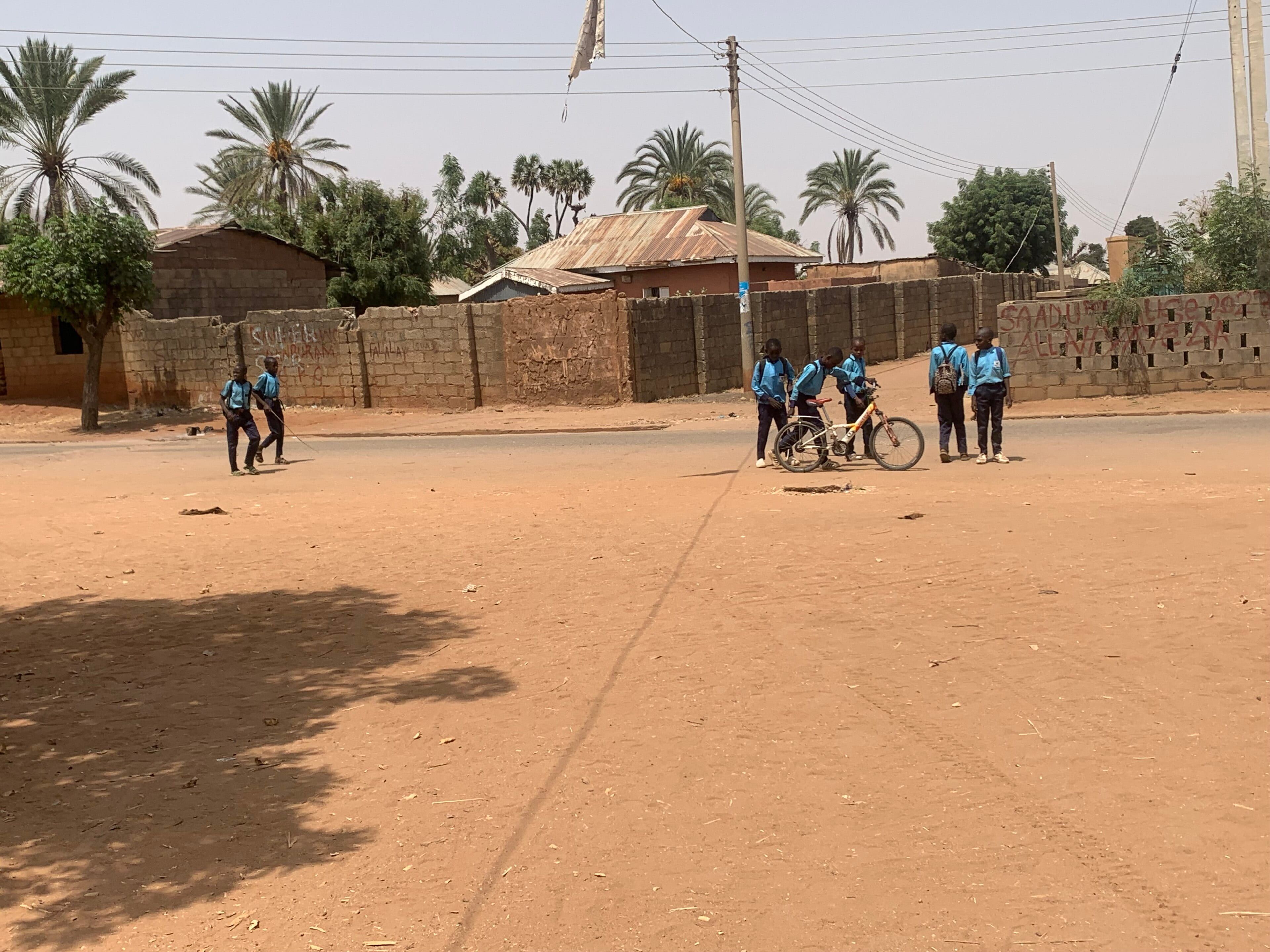 Primary school pupils on their way home, Kwami, Nigeria (illustration)